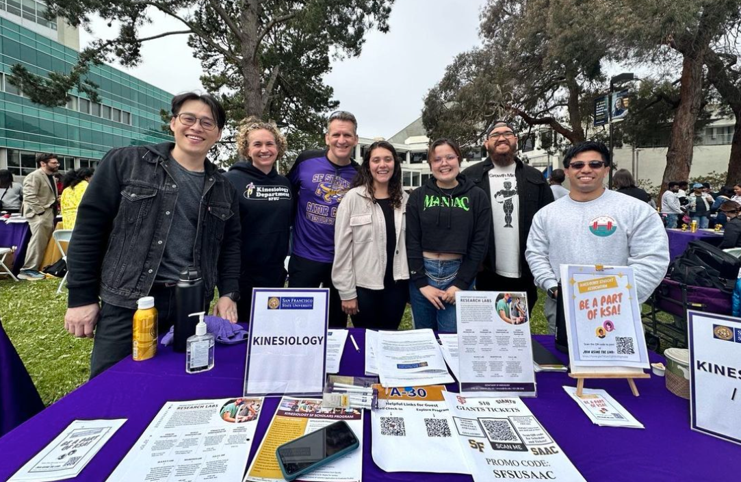 kinesiology students and staff behind table at Explore SF State Day