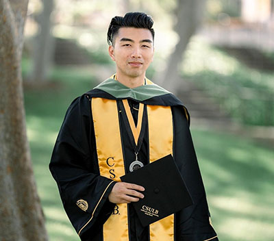 Randy Nguyen in graduation regalia