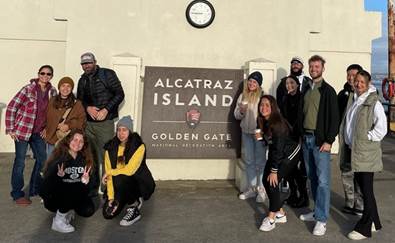group of students in front of ferry gate to Alcatraz