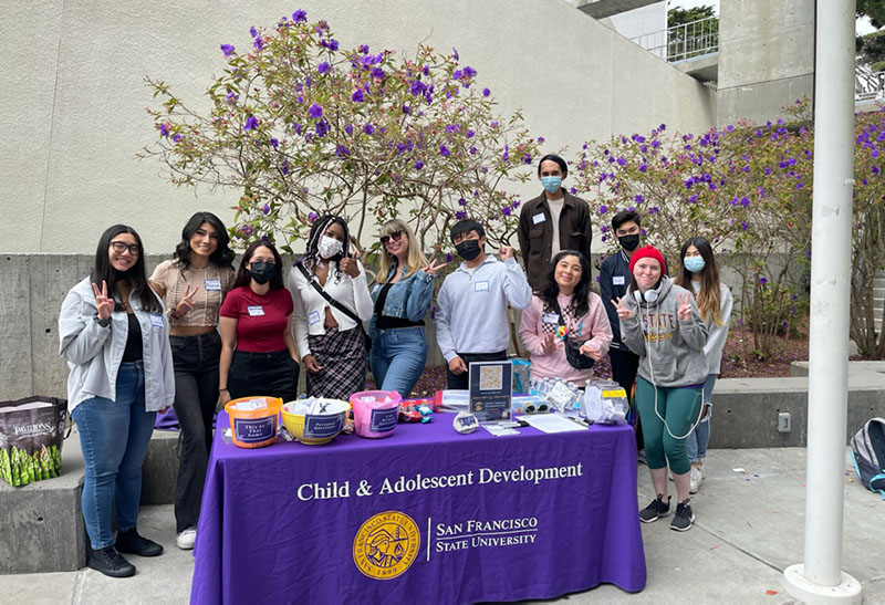 CAD student group behind display table