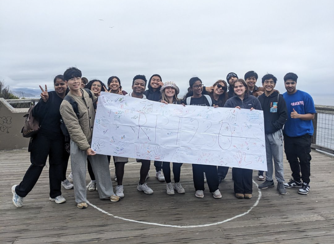 Group shot of students from RPT 230 class at Fort Funston holding banner