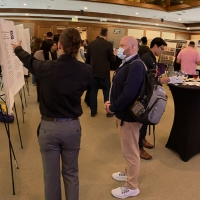 Attendees look at posters at CHSS Undergrad Showcase