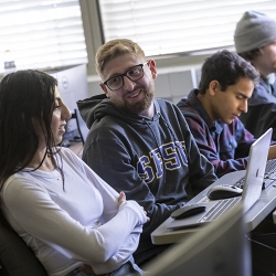 three students in classroom