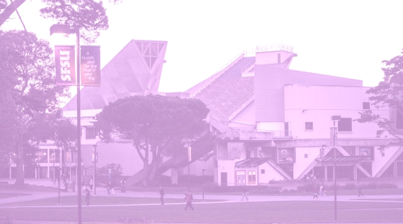 The Cesar Chavez building on campus with a purple filter over it.