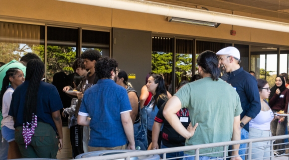 Students, faculty, and alumni conversing
